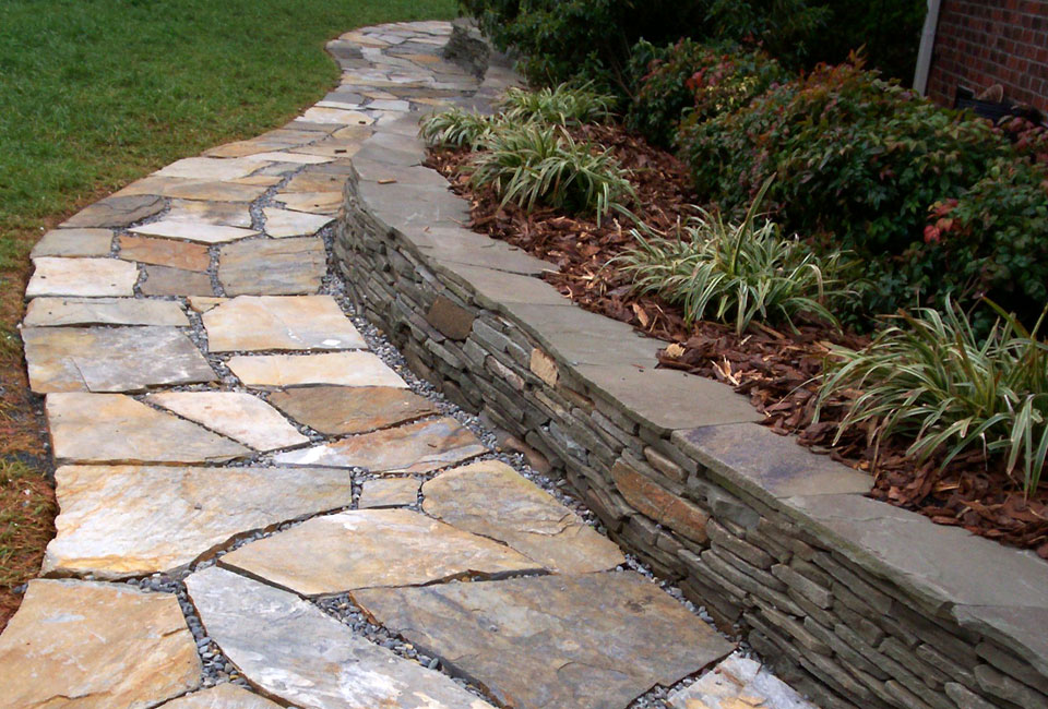 'Mojave' Flagstone Walkway w/ 'Colonial Gray' Thin Veneer Retaining Wall w/ 'Variegated' Liriope & 'Firepower' Dwarf Nandina in background