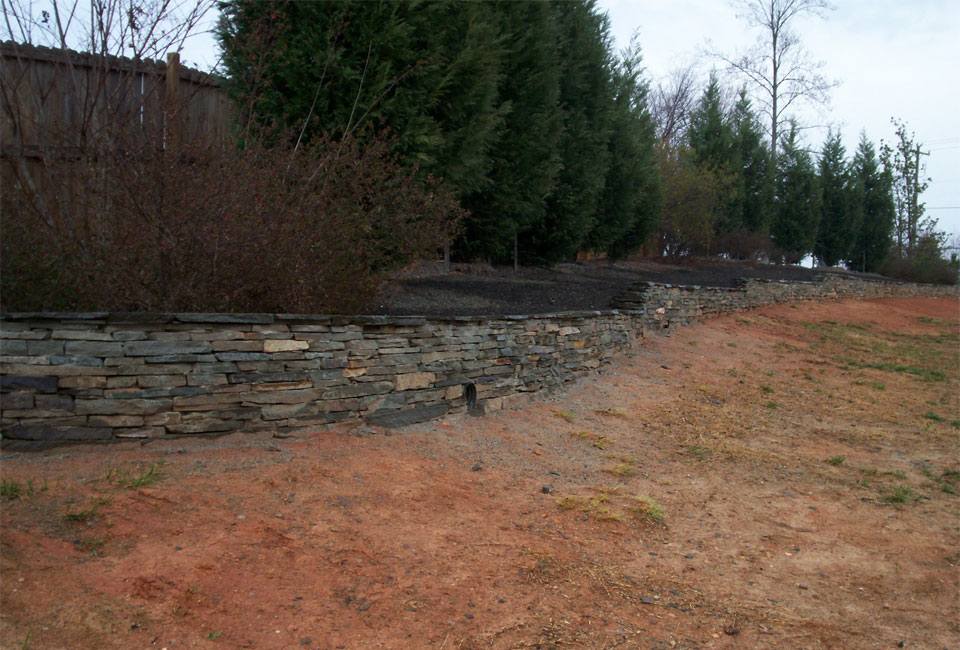 View from bottom of Tennessee Fieldstone blended w/ 'Colonial Gray' Thin Veneer Mortared Retaining Wall showing Multiple Tiers & Levels